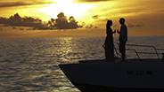 Couple on romantic sunset boat ride